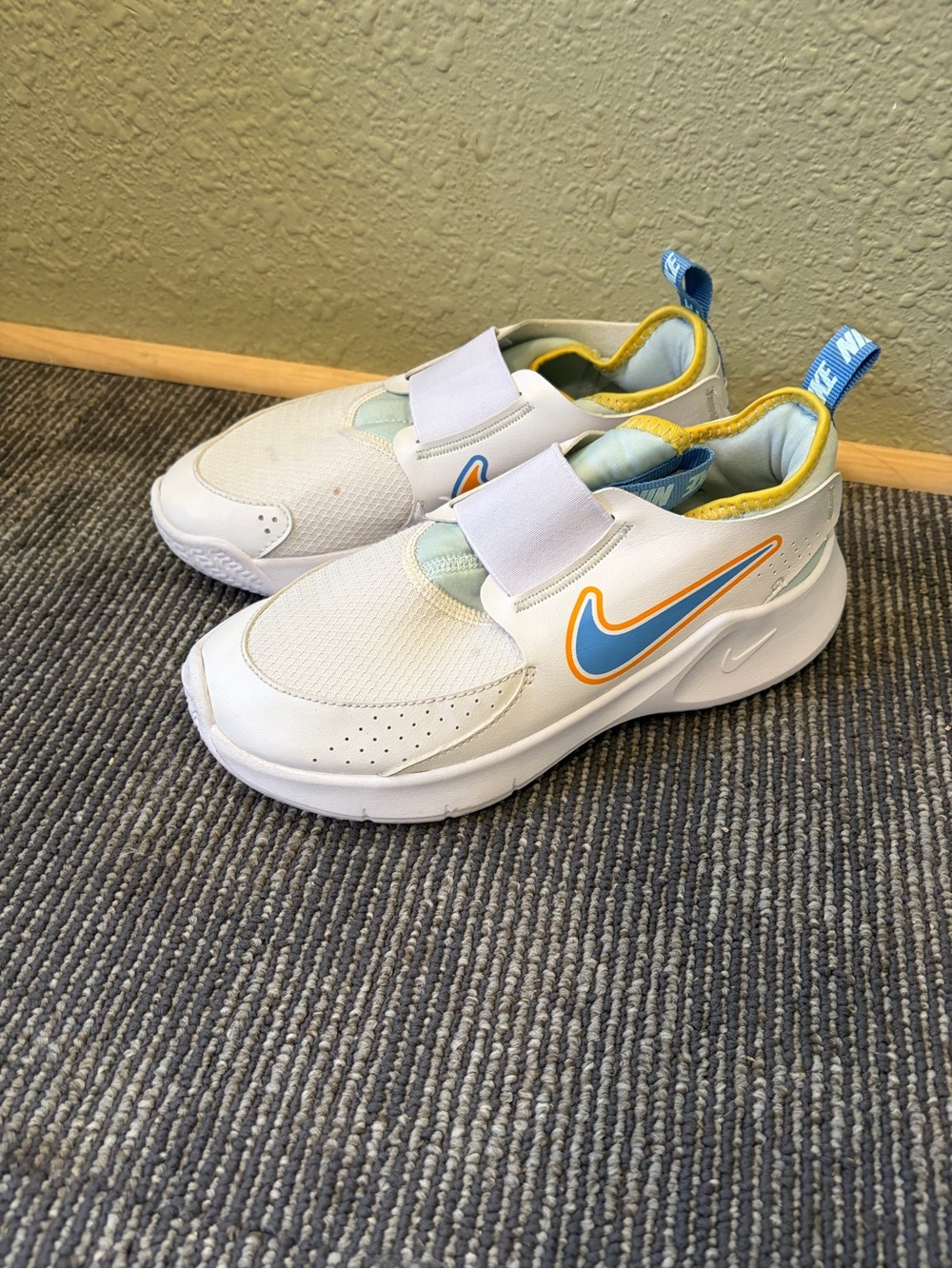 Nike Kids White Sneakers with Blue and Yellow Swoosh Accent Size 3Y